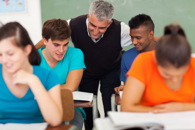 Teacher and students interacting.